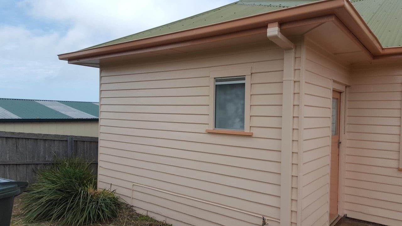 Weatherboard exterior repainted in cream with contrast trim, by BPM Group